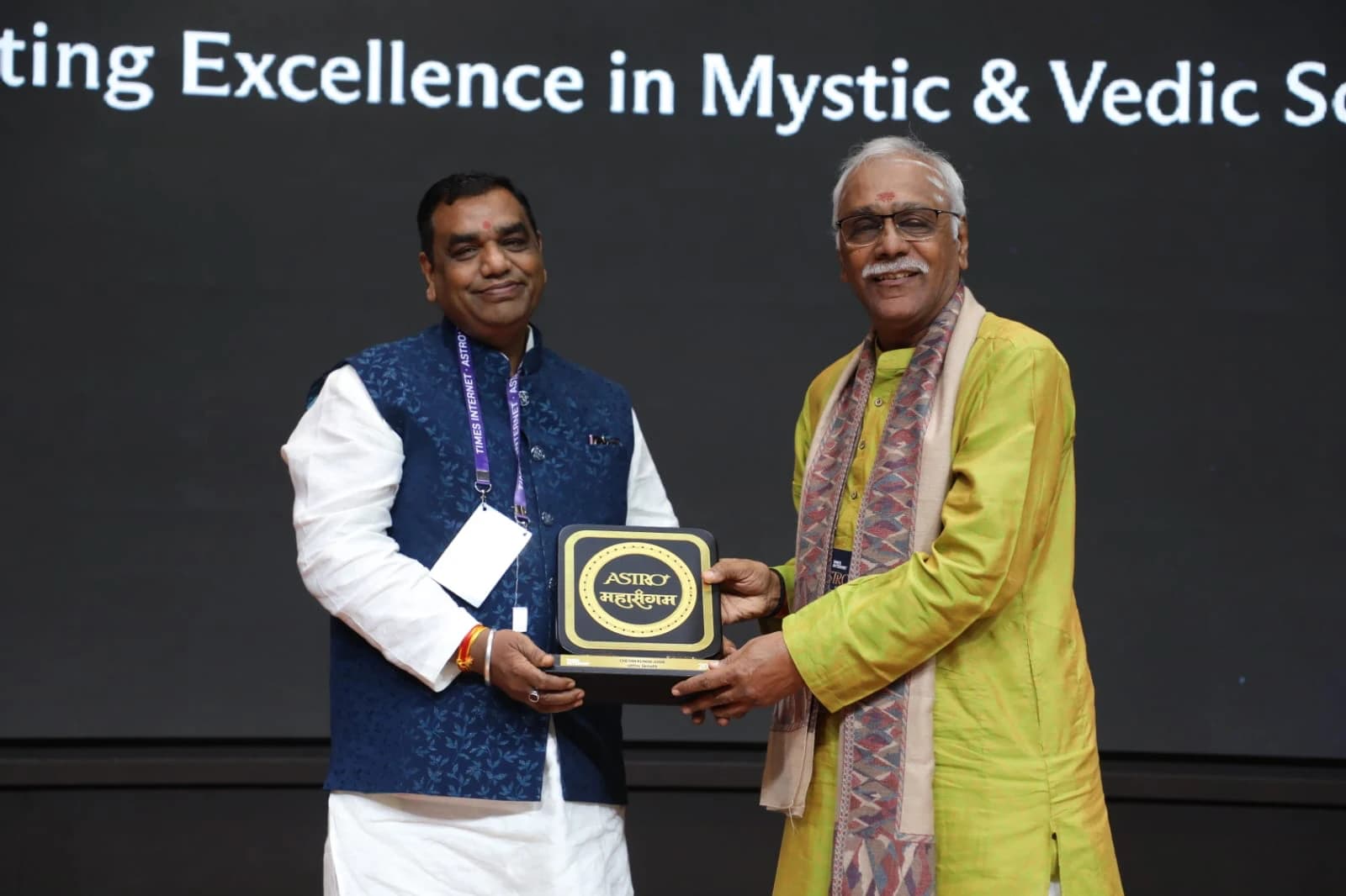 Receiving a memento on stage at the Times Internet Astro Mahasangam